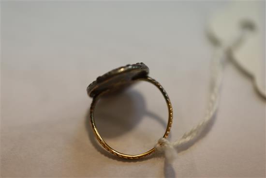 A George III gold and diamond set oval portrait ring, size G/H.